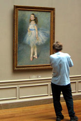 Man looking at painting